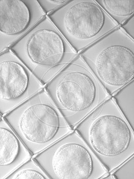 Cosmetic background white isolated from cotton pads and cotton swabs