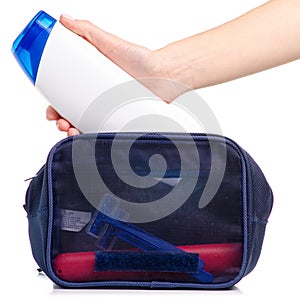 Cosmetic bag bath shampoo in hand razor toothbrush