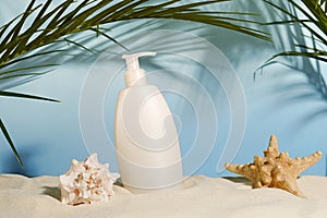 Cosmetic body care product for skin or hair, shampoo or gel, summer beach with palm leaves on blue background