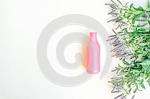 Cosmetic bottle with a bouquet of mint blossoms