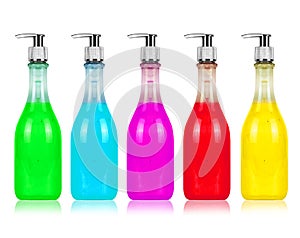 Cosmetic bottle in multi-colored versions isolated on white photo