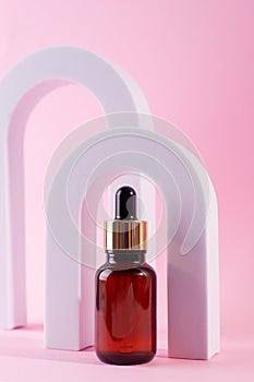 Cosmetic bottle with serum in arch. Skin care cosmetic. Hyaluronic acid oil, serum with collagen and peptides