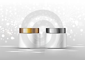 Cosmetic bottles for cream. White jar and gold, silver glossy lid on the gray background for ads.