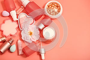 Cosmetic bottles and jars on a pink monochrome background. Asian cosmetics for skin care close-up