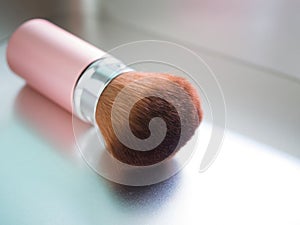 Cosmetic brush on metal background