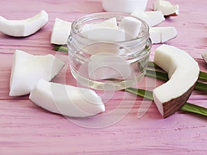 Cosmetic coconut cream organic nature therapy healthy homemade on a pink wooden background