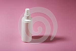 Cosmetic container with cosmetic product on a pink background