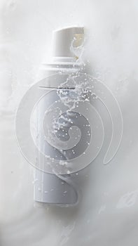 Cosmetic container white lotion droplet fly splashing. Milk lotion pour float to cosmetic bottle. Moisturizer lotion explosion