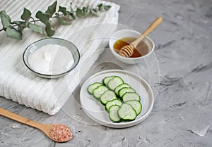 Cosmetic cream, face mask, scrub, cucumber, white bath towel