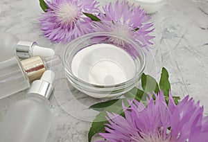Cosmetic cream, flower   anti-agin cleansing  g protection    on a concrete background