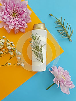 Cosmetic cream, flower on a colored background
