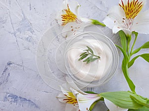 Cosmetic cream, flower   a concrete background