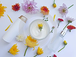 Cosmetic cream, flower product on a colored background wellness