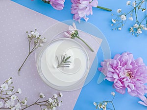 Cosmetic cream, flower  relaxation   moisturizer   skin  on a colored background product