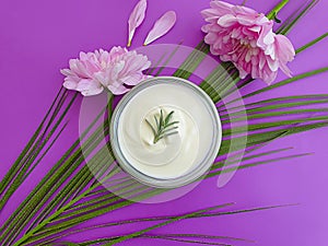 Cosmetic cream health , flower on a colored background