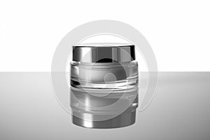 a Cosmetic cream jar on white background with reflection and shadow