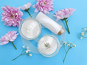 Cosmetic cream, protection  flower  a colored background