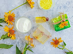 Cosmetic cream relaxation , aromatherapy calendula flower soap on concrete background