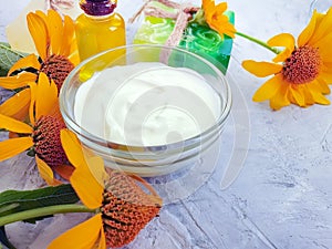 Cosmetic cream relaxation , aromatherapy decoration spa calendula flower soap on concrete background