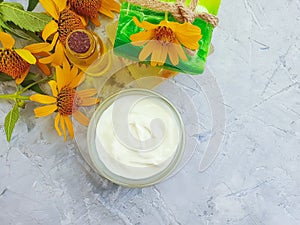 Cosmetic cream relaxation , aromatherapy spa calendula flower soap on concrete background