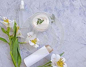 Cosmetic cream, wellness  organic  protection  relaxation  hygiene  flower on a concrete background