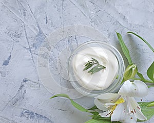 Cosmetic cream, wellness  organic relaxation  hygiene  flower on a concrete background