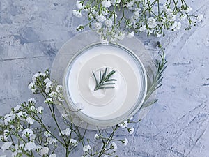 Cosmetic cream, wellness product   lotion flower on on a concrete background
