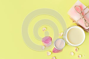 Cosmetic creams, lip balt on a yellow background.Spa beauty care. Space for a text. Copy space. spa flat lay. Pink, blue. The conc