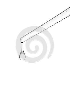 Cosmetic dropper with yellow oil. Glass dropper isolated on a white background. Path saved