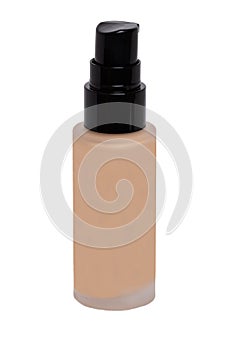 Cosmetic foundation isolated. Close-up of an closed glass bottle with liquid skin foundation isolated on a white background.