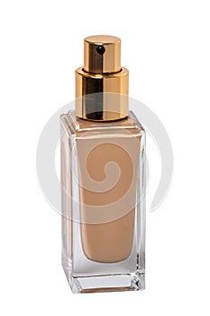 Cosmetic foundation isolated. Close-up of an closed glass bottle with liquid skin foundation isolated on a white background.