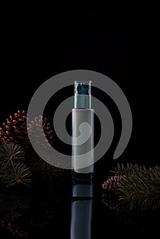 cosmetic hyaluronic face cream with pine on a black background