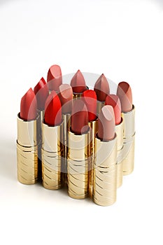 Cosmetic lipstick, opened tubes on a white background