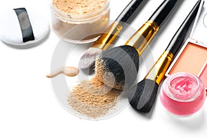 Cosmetic liquid foundation or cream, loose face powder, various brushes for apply makeup. Make up concealer smear