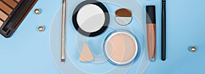cosmetic makeup background. Fashionable women\'s cosmetics, brushes, lipstick, sponge, powder, eye shadow. Creative blure