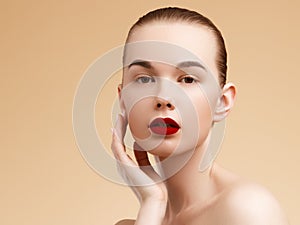 Cosmetic and Makeup. Beauty Fashion Model Woman face. Portrait with perfect skin. Red Lips and Nails