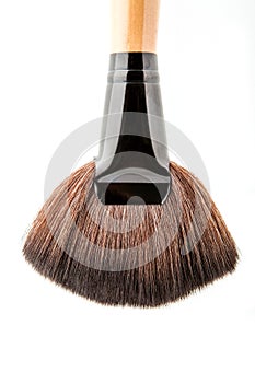 Cosmetic makeup brush on white blackground close up