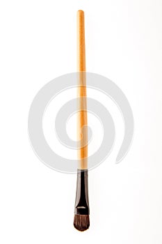 Cosmetic makeup brush on white blackground close up