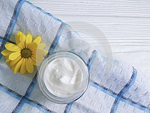 Cosmetic cream organic morning table yellow chrysanthemum flower white wooden, daisy, towel