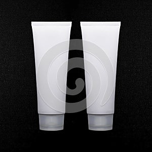 Cosmetic packaging design. White cream tube. Cosmetics mockup for branding. Beauty makeup product. texture black background