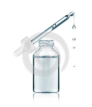 Cosmetic pipette with dripping drops close-up isolated on a white background