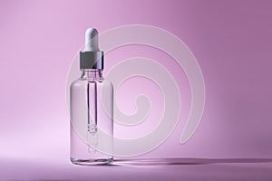 Cosmetic pipette with hyaluronic acid. Transparent gel with bubbles close-up. Gel cream or serum. A sample of a cosmetic product.