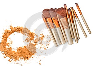 Cosmetic powder brush circle box and crushed make up color isolated on white.