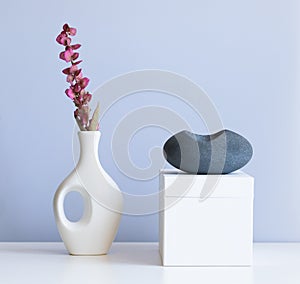 cosmetic product mock up with white boxes and vase