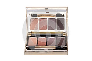 Cosmetic products isolated. Close-up of a elegant cosmetic multi-color box with mirror, eye shadows powder and a eye shadow brush