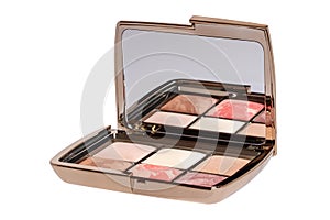 Cosmetic products isolated. Close-up of a elegant opened box with various cheek or face powder in it isolated on a white