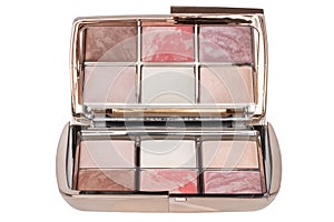 Cosmetic products isolated. Close-up of a elegant opened box with various cheek or face powder in it isolated on a white