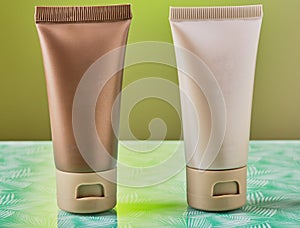 Cosmetic products isolated on green.