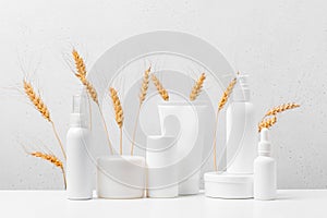 Cosmetic products on the table, white bottles and containers, mock-up scene