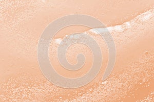 Cosmetic scrub texture background. Skincare exfoliation product sample macro